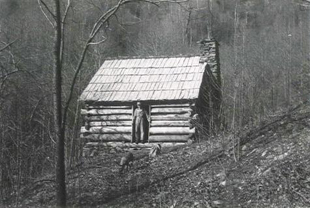 A man in the doorway of the Caudill Cabin